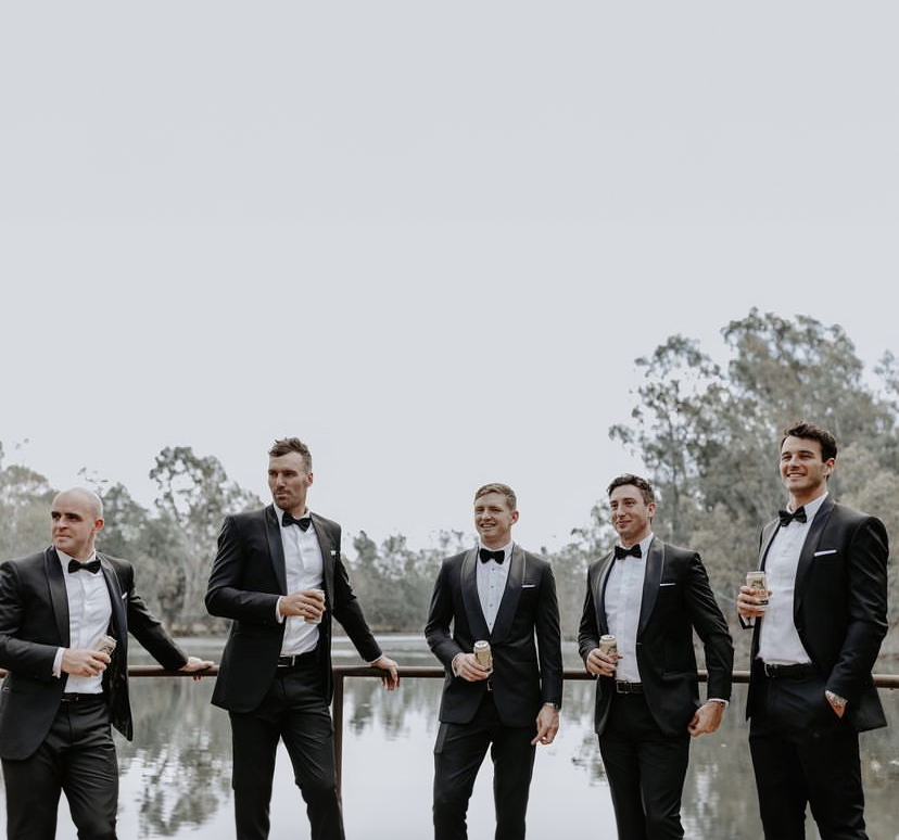 Bespoke suit clients styled by Germanicos for weddings and formal events