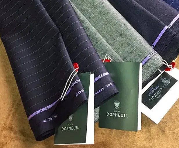 Luxury Dormeuil suiting fabrics in assorted patterns and colors for bespoke tailoring
