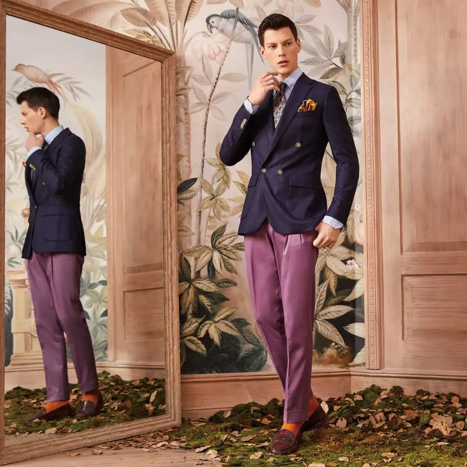 Navy double-breasted sports jacket worn with mauve trousers and a patterned tie, by Germanicos