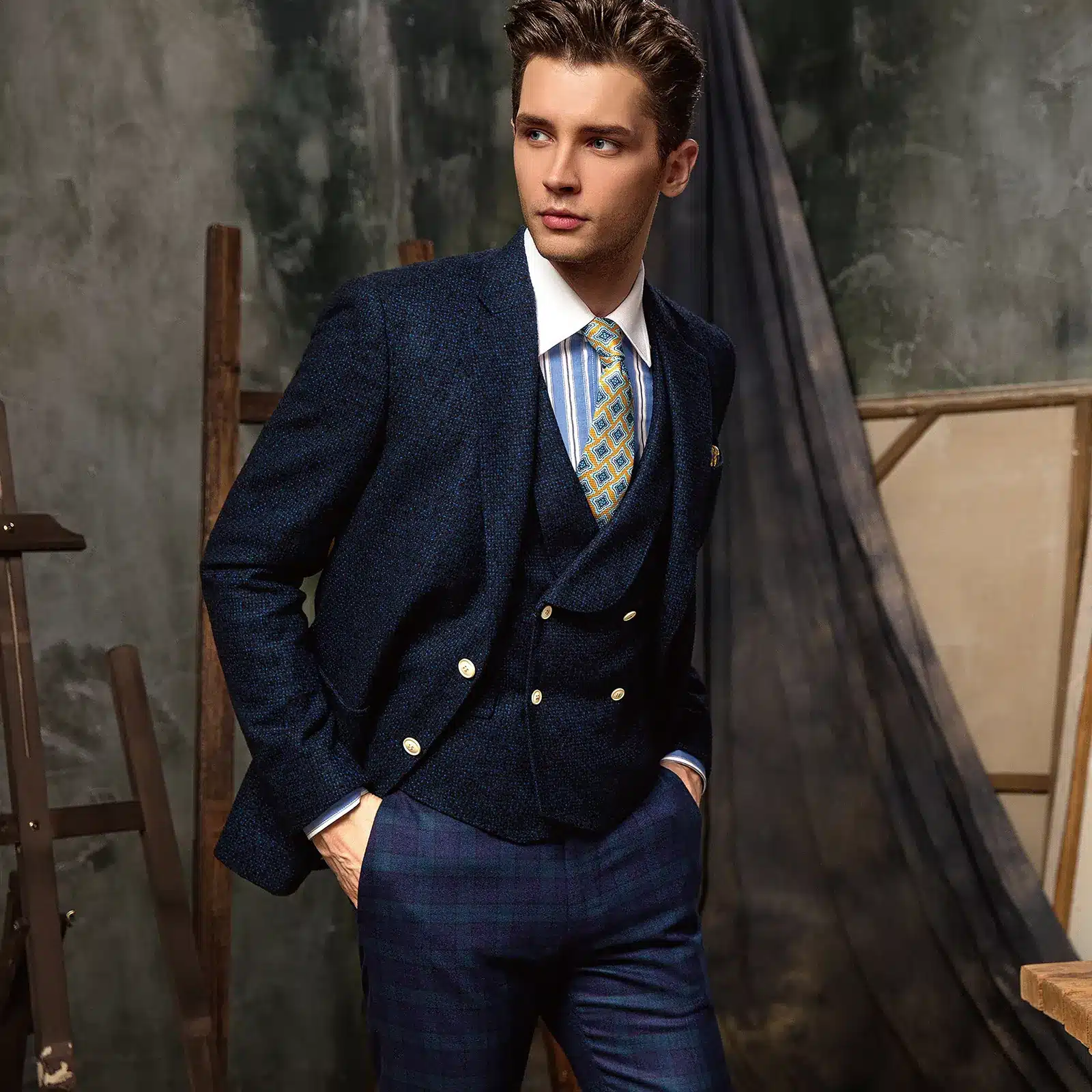 Navy textured sports jacket with a matching double-breasted waistcoat, striped shirt and yellow tie